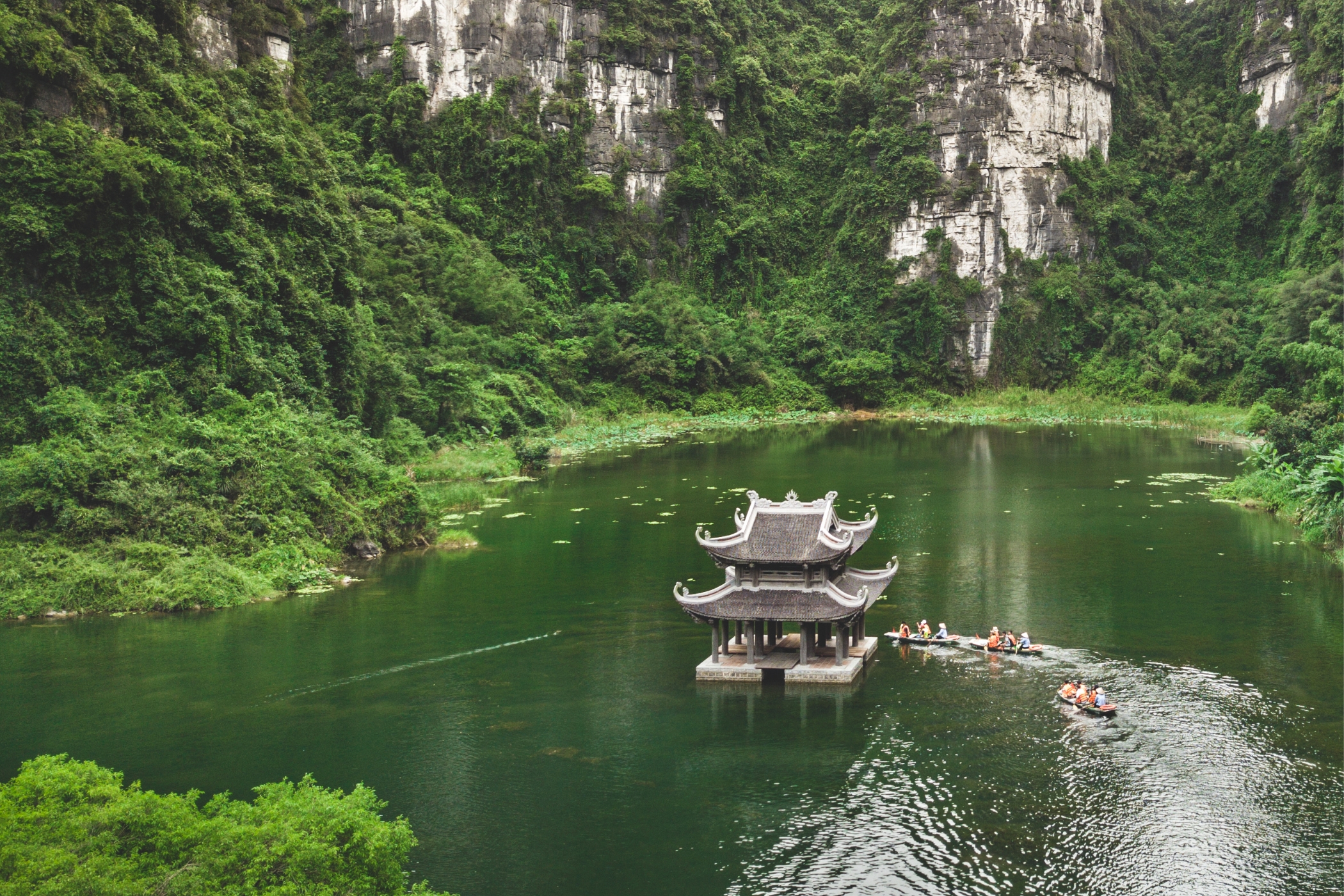 Cruise through Ninh Binh’s serene waterways and admire its towering limestone karsts